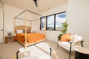Bedroom with light colored carpet, a ceiling fan, and recessed lighting