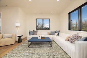 Living area featuring recessed lighting and wood finished floors