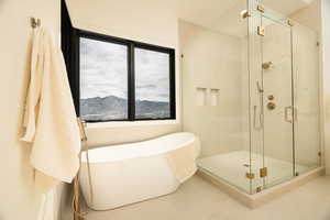 Full bathroom with a soaking tub and a shower stall