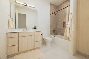 Full bath featuring vanity and shower / tub combo