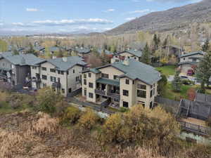 Aerial perspective of suburban area with a mountain backdrop