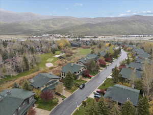 View of property location with a mountain backdrop and nearby suburban area