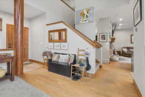 Living room featuring light wood finished floors and recessed lighting
