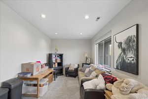 Living room featuring light carpet and recessed lighting