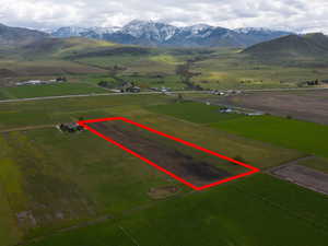 View of rural area with a mountain backdrop and property parcel outlined