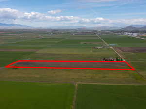 View of rural area with a mountainous background and abundant farmland