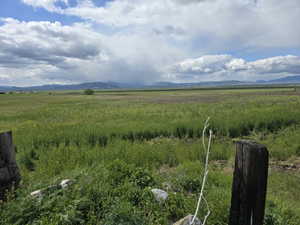 View of mountain backdrop with rural landscape