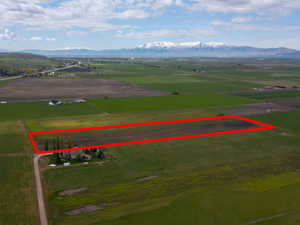 Aerial view of sparsely populated area with extensive farmland and property parcel outlined