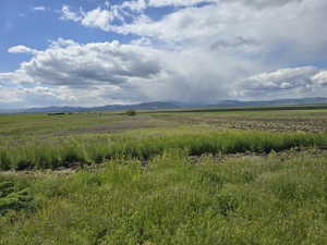View of mountain background featuring rural landscape