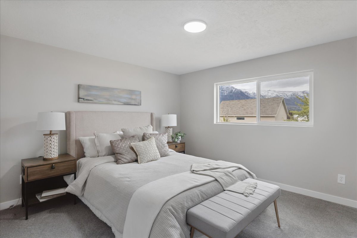 Carpeted bedroom with baseboards