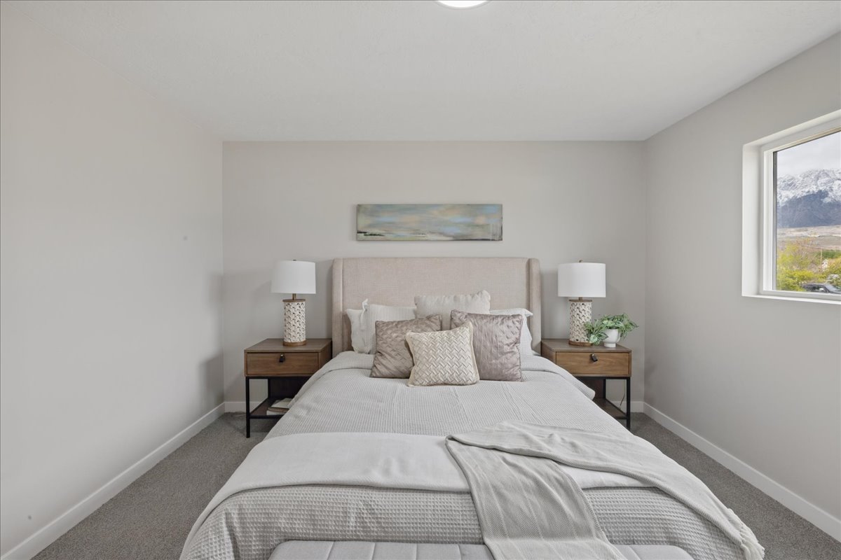 Carpeted bedroom with baseboards