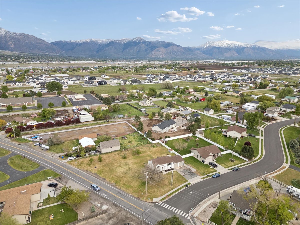 Aerial perspective of suburban area with a mountain backdrop
