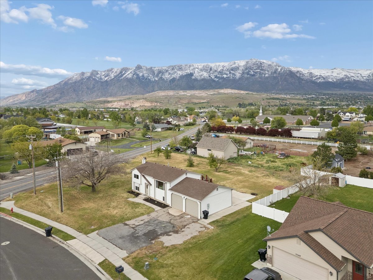 Aerial view of residential area with a mountainous background