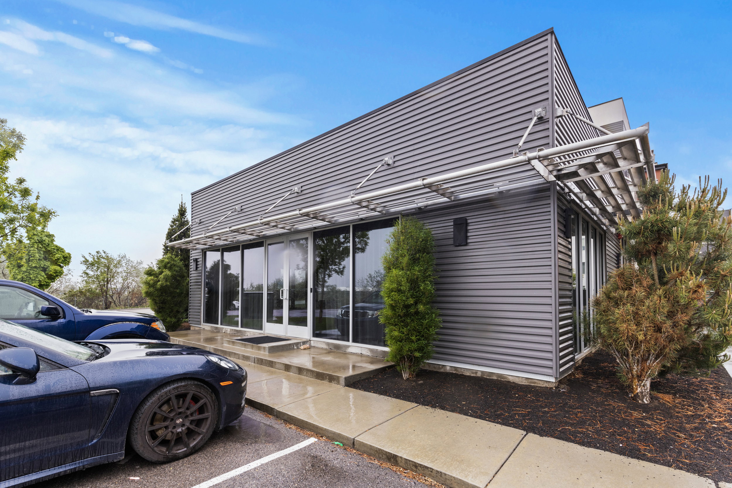 View of side of home featuring uncovered parking