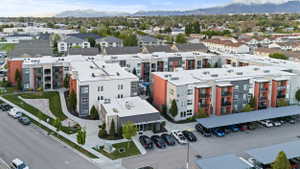 Bird's eye view of apartment complex and a mountain backdrop
