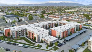Bird's eye view of a mountain backdrop and apartment complex / building