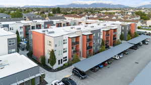Aerial view of a mountainous background and apartment complex