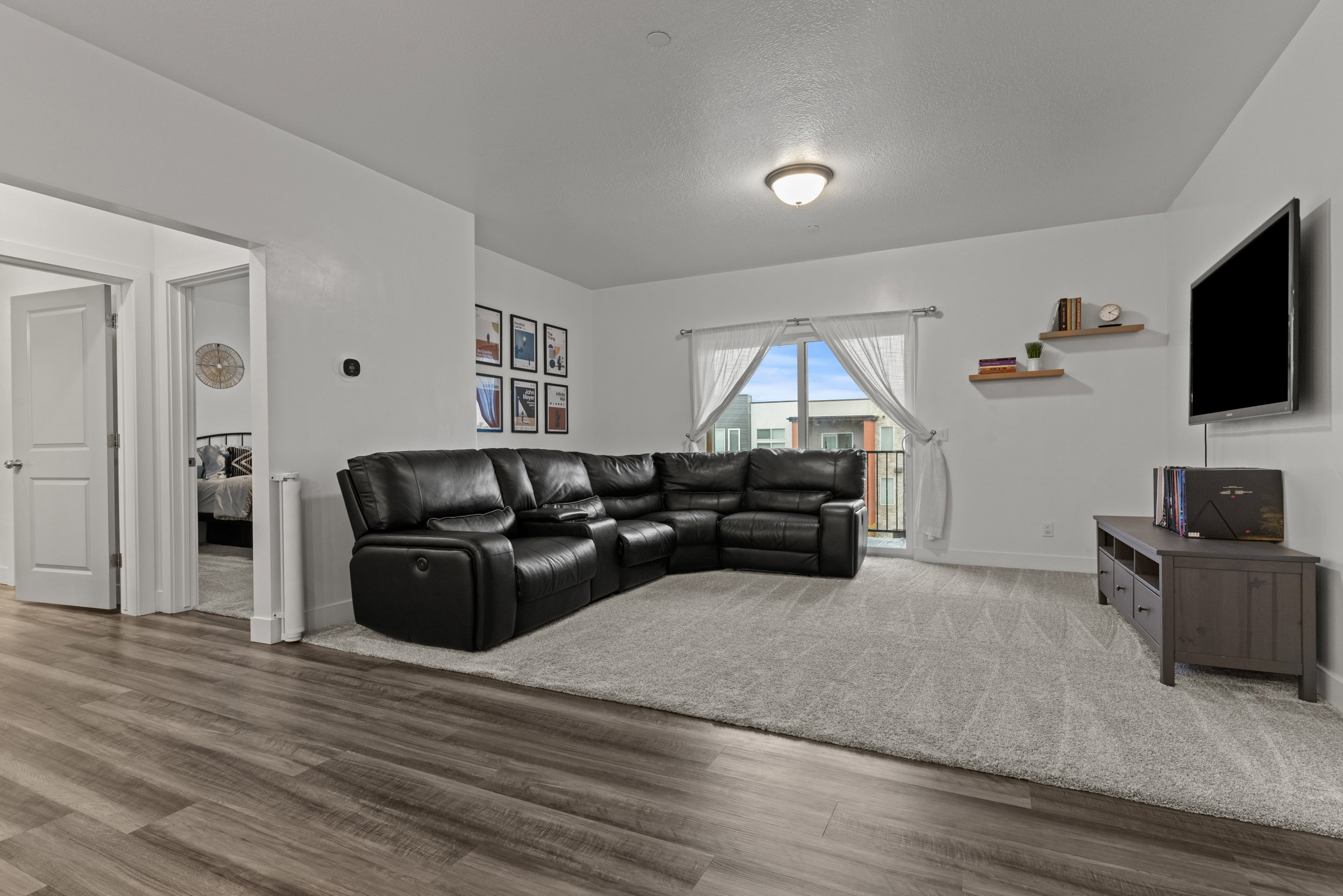 Living room featuring baseboards and wood finished floors