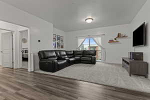 Living room featuring baseboards and wood finished floors