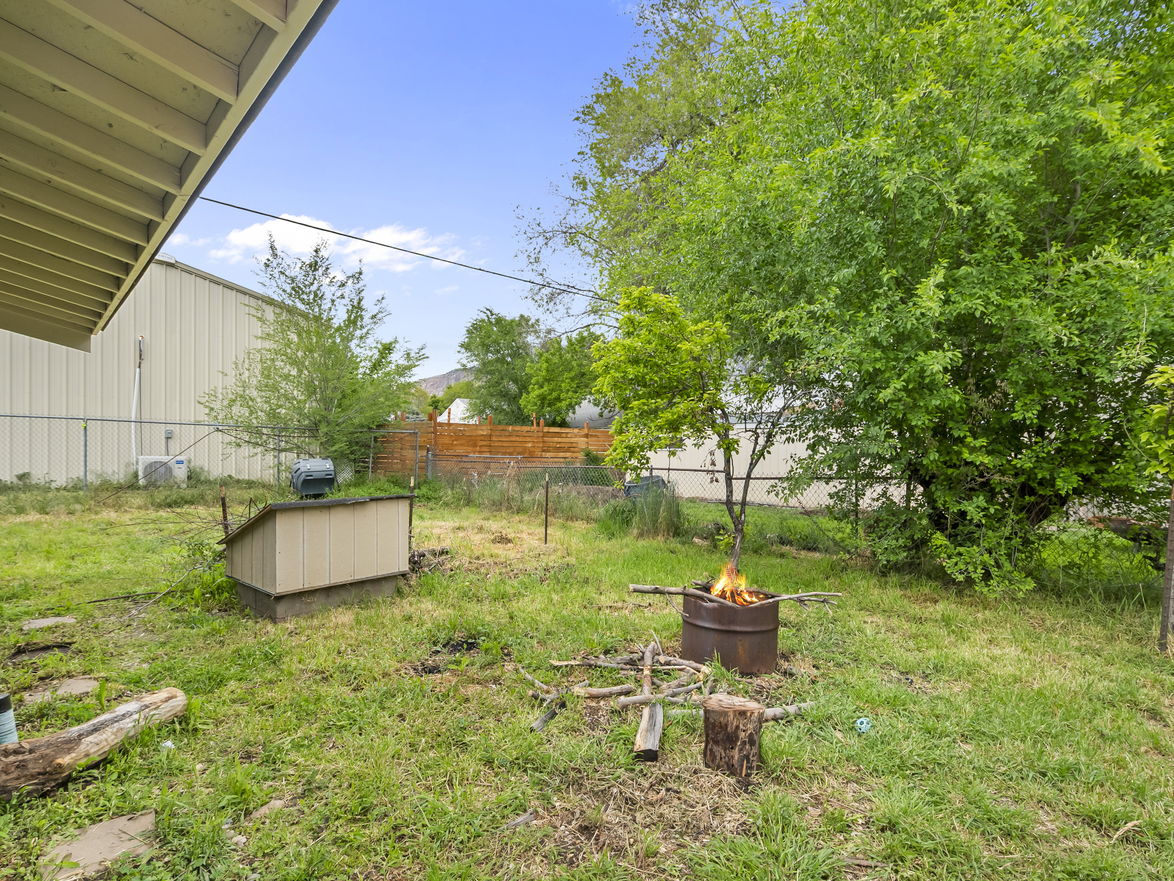 View of yard with a fire pit
