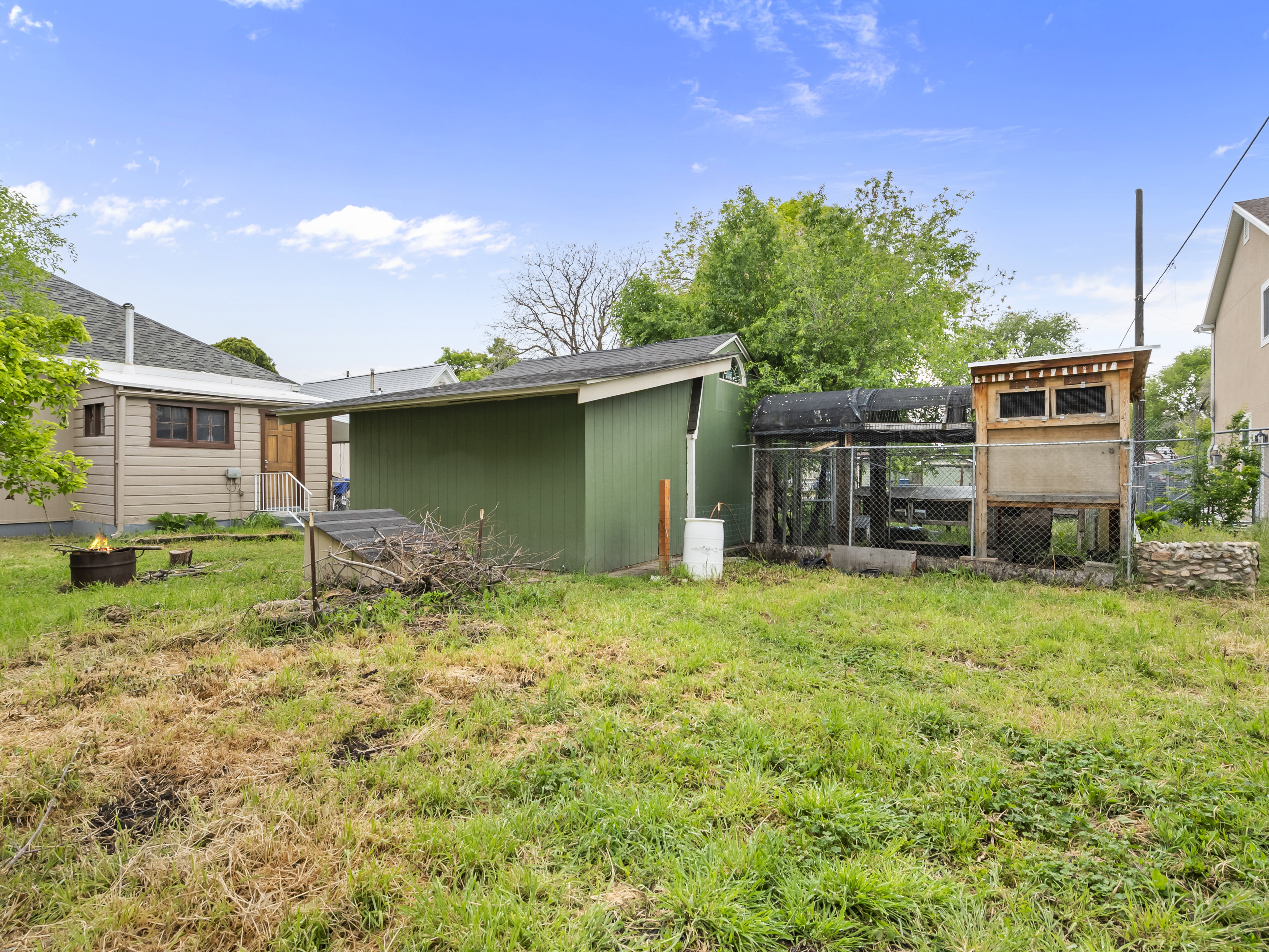 View of yard featuring an outbuilding and exterior structure
