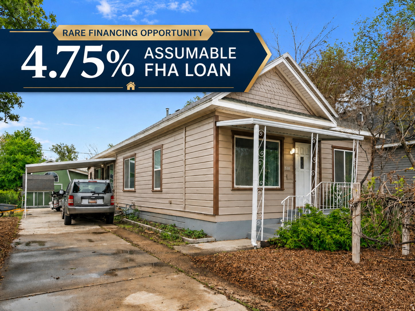 Single-story home featuring a covered front porch with decorative metal railings, a paved driveway, and a detached carport