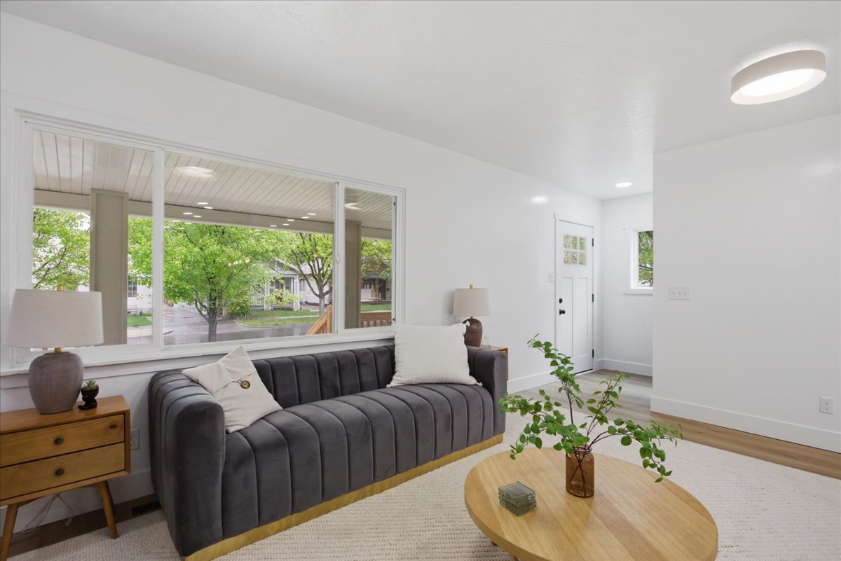 Living room with baseboards and light wood finished floors
