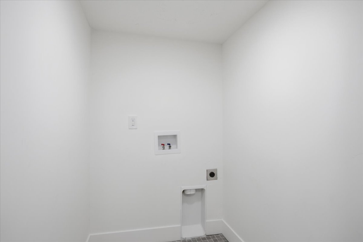 Laundry area with hookup for a washing machine and hookup for an electric dryer