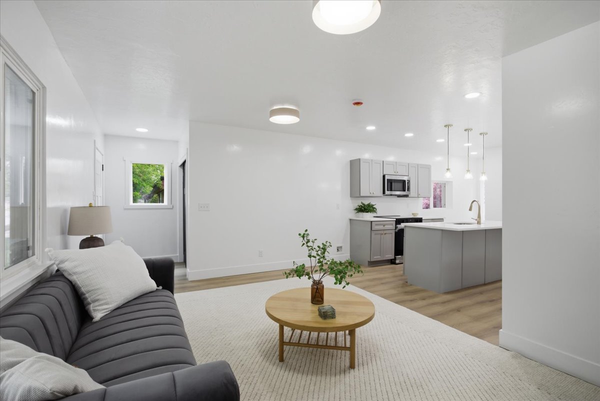 Living area featuring light wood-style floors and baseboards