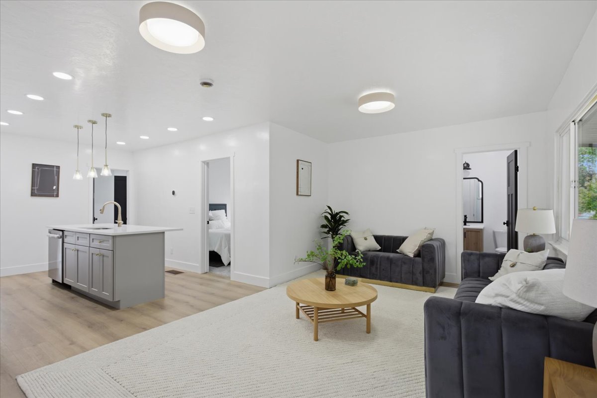 Living room featuring light wood-style flooring and recessed lighting