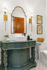 Bathroom featuring toilet and vanity