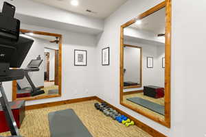 Exercise room featuring baseboards