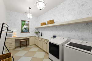 Laundry area with light floors, wallpapered walls, and washer and clothes dryer