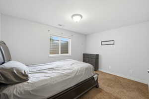 Bedroom with baseboards and carpet flooring