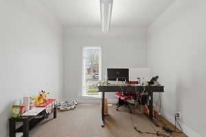 Office with light colored carpet