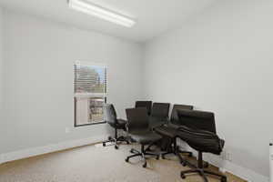 Home office with light colored carpet