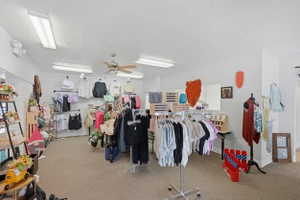 Miscellaneous room with a textured ceiling and a ceiling fan