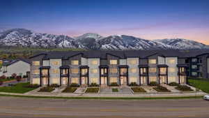 View of front of property featuring a mountain view and stone siding