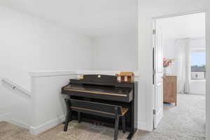 Interior space with carpet and baseboards