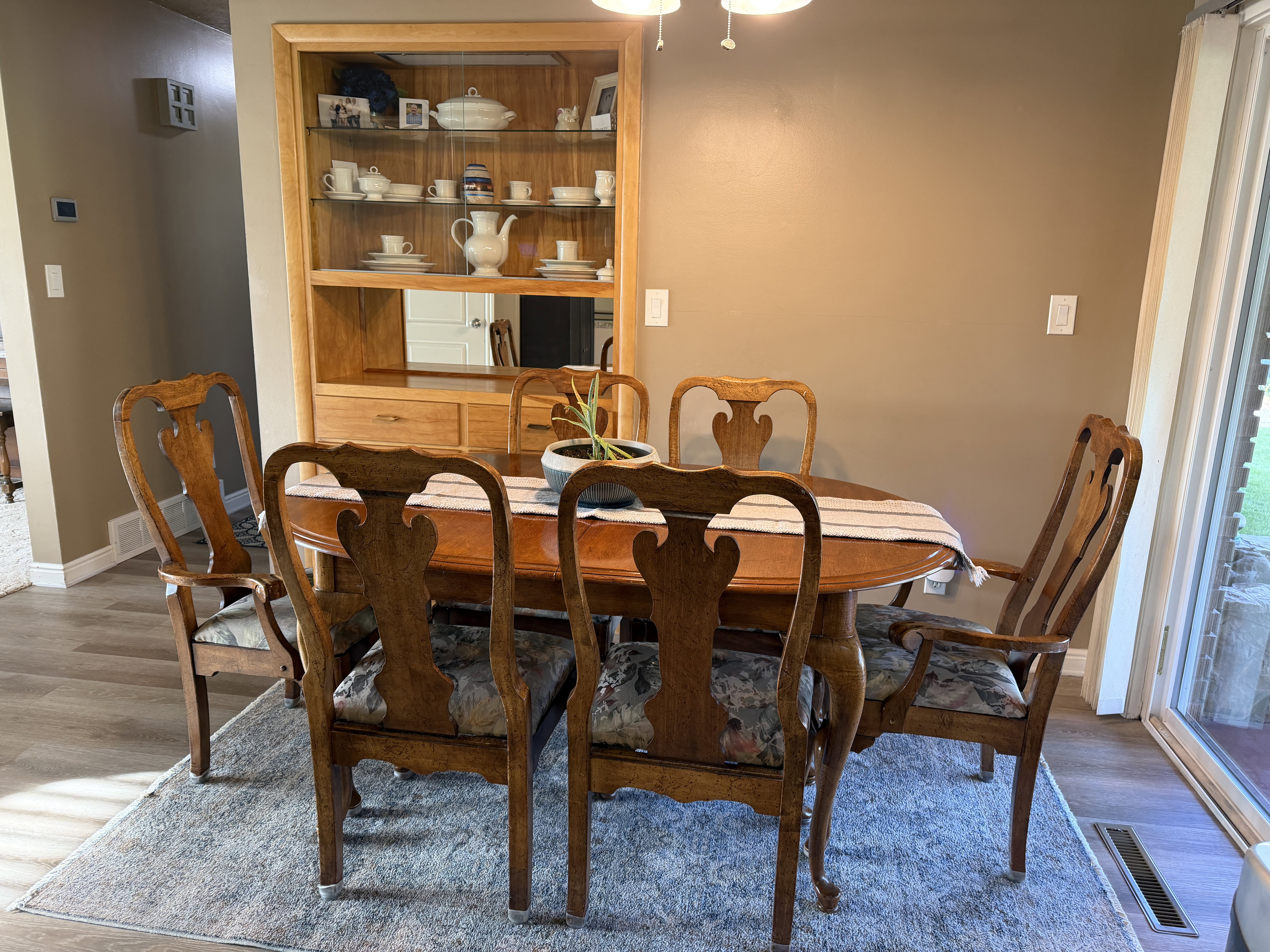 Dining room featuring LVP floors and built in.