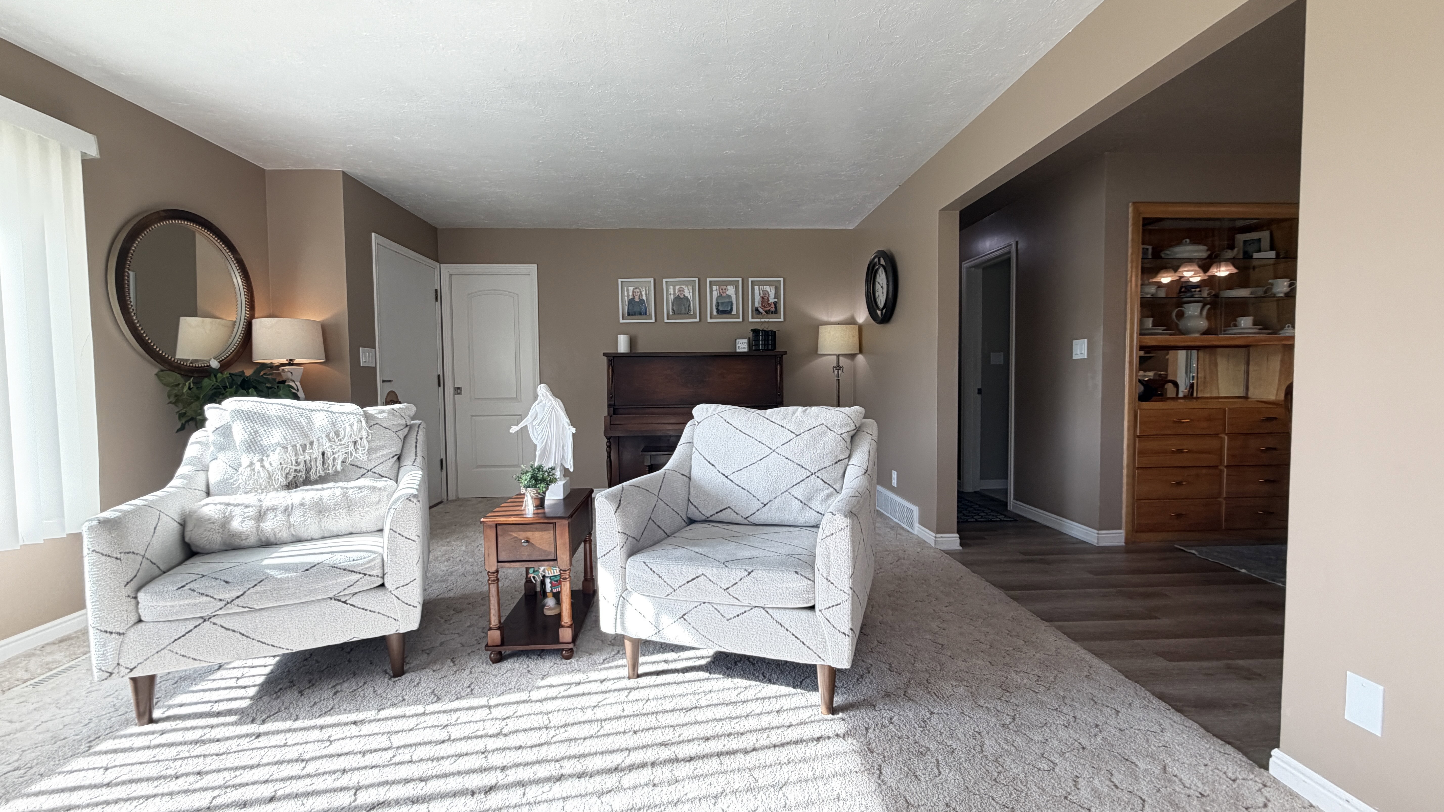 Entry formal and Family room with large windows and opened to the dining area.