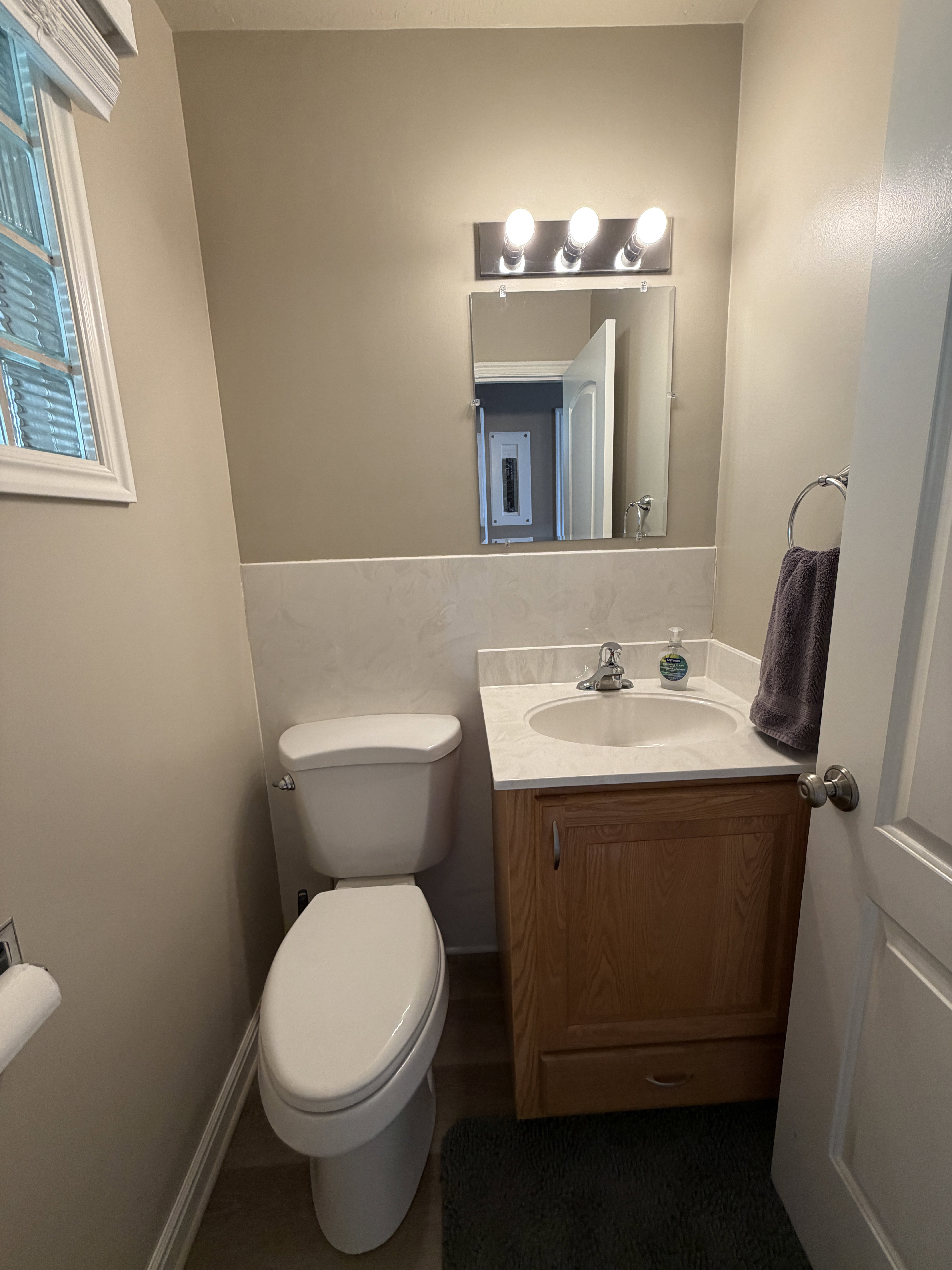 1/2 bath conveniently located off the kitchen, by patio, garage, laundry and by second entry