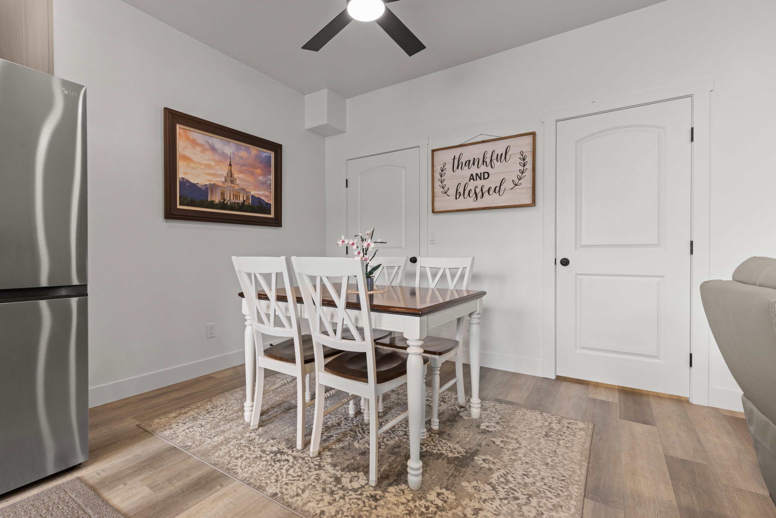 Dining space featuring wood finished floors and ceiling fan