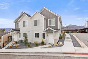 Traditional home featuring a mountain view and board and batten siding