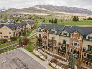 Aerial perspective of suburban area featuring a mountain backdrop