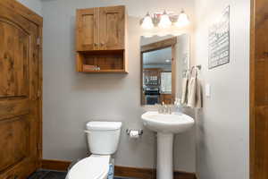 Bathroom featuring toilet and baseboards