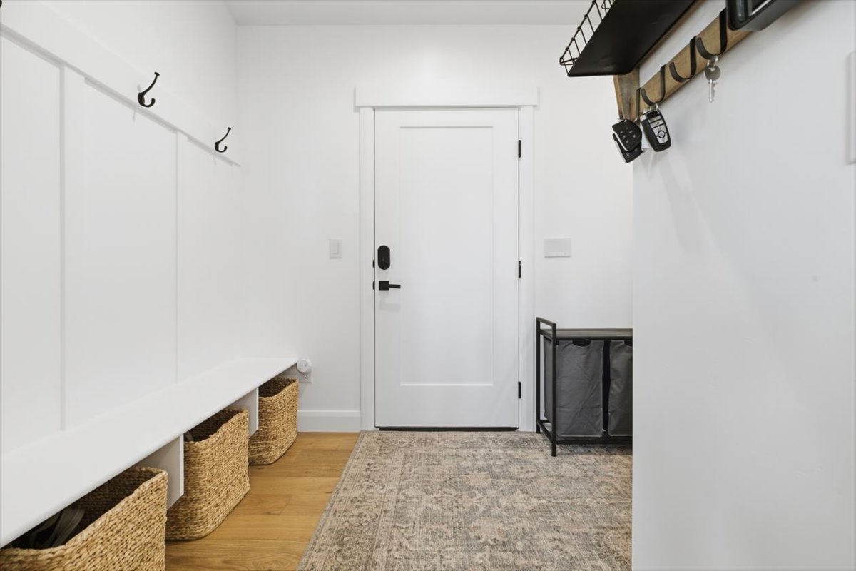 Mudroom featuring light wood-type flooring
