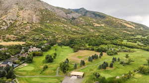 Bird's eye view of a local golf course and a mountain backdrop