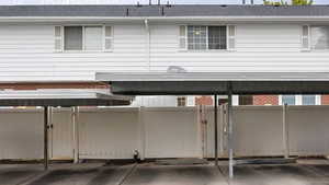 Garage with a gate and covered parking