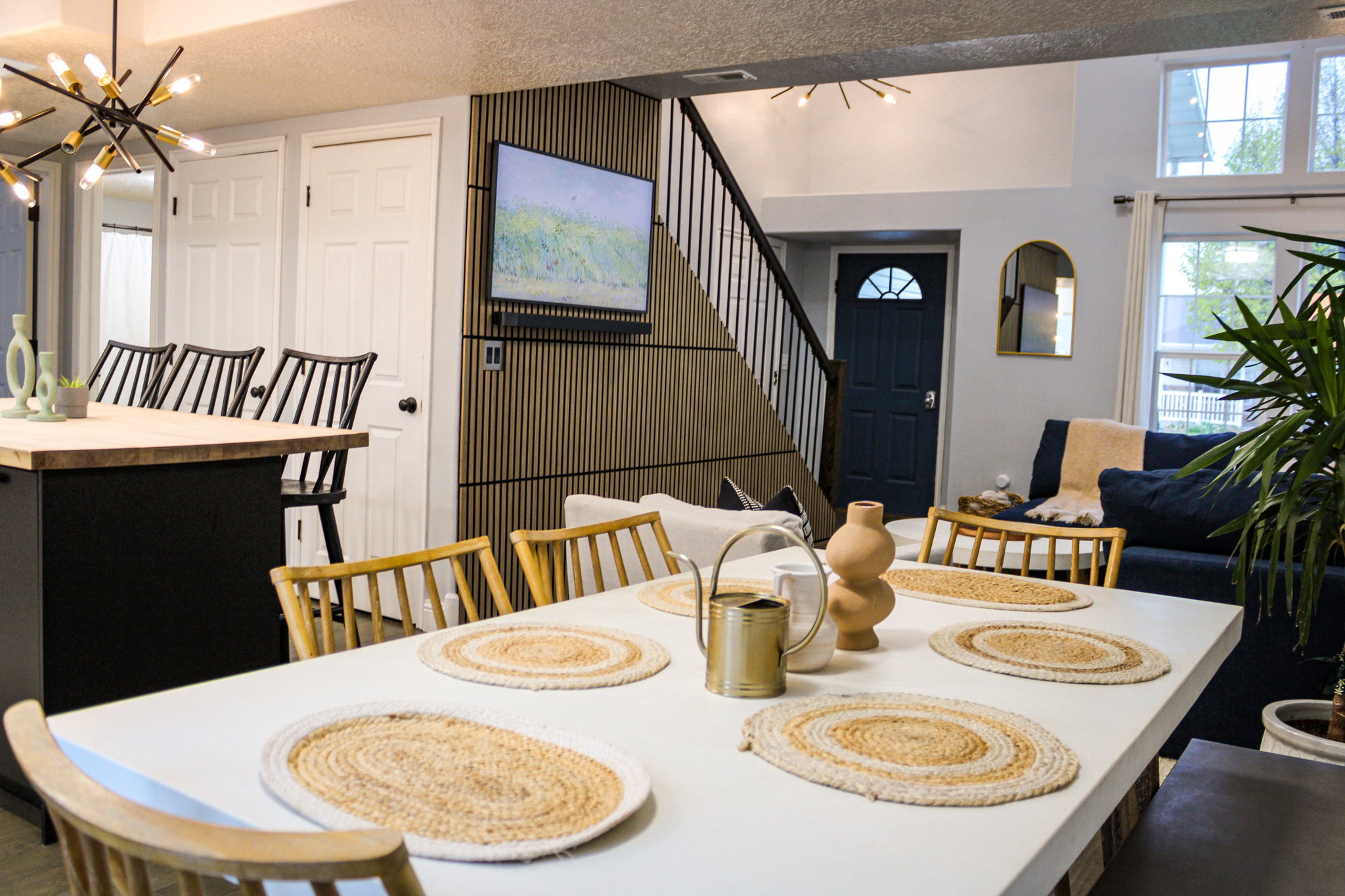 Dining area with a chandelier, plenty of natural light, and a textured ceiling